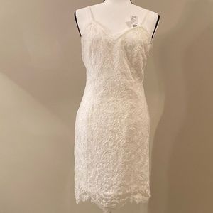 White Lace covered dress. Mid-Thigh length. Size L